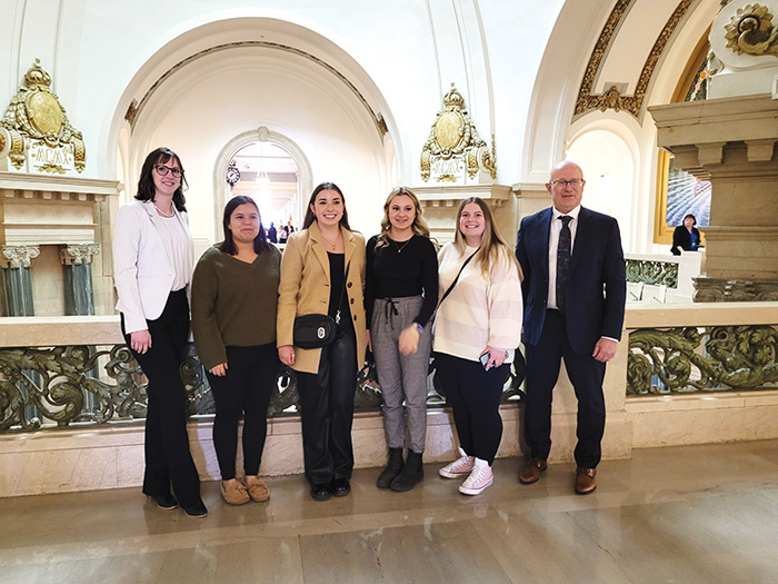 From left are Shayna Zubko, Leahanne Pangracs, Taryn Rushinko, Cassidy Hudacek, Darien Mickle, and Melville-Saltcoats MLA Warren Kaeding at the Legislature on budget day last week.<br />
